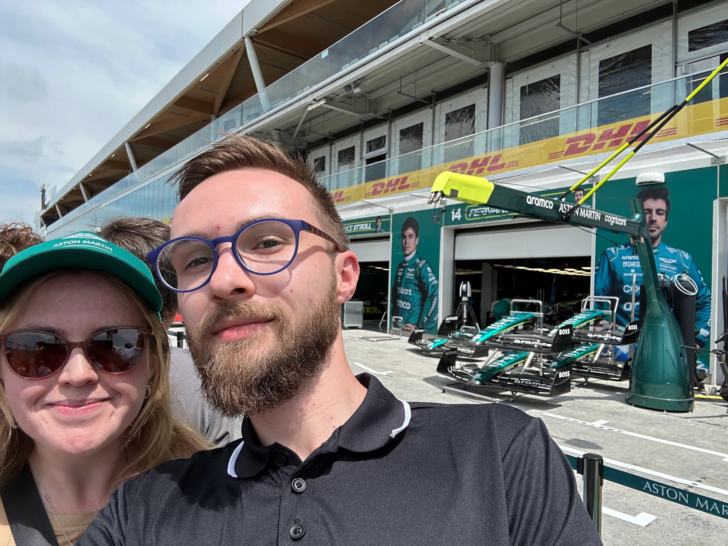 Rachel and Reid at the Grand Prix in front of the Aston Martin pit garage