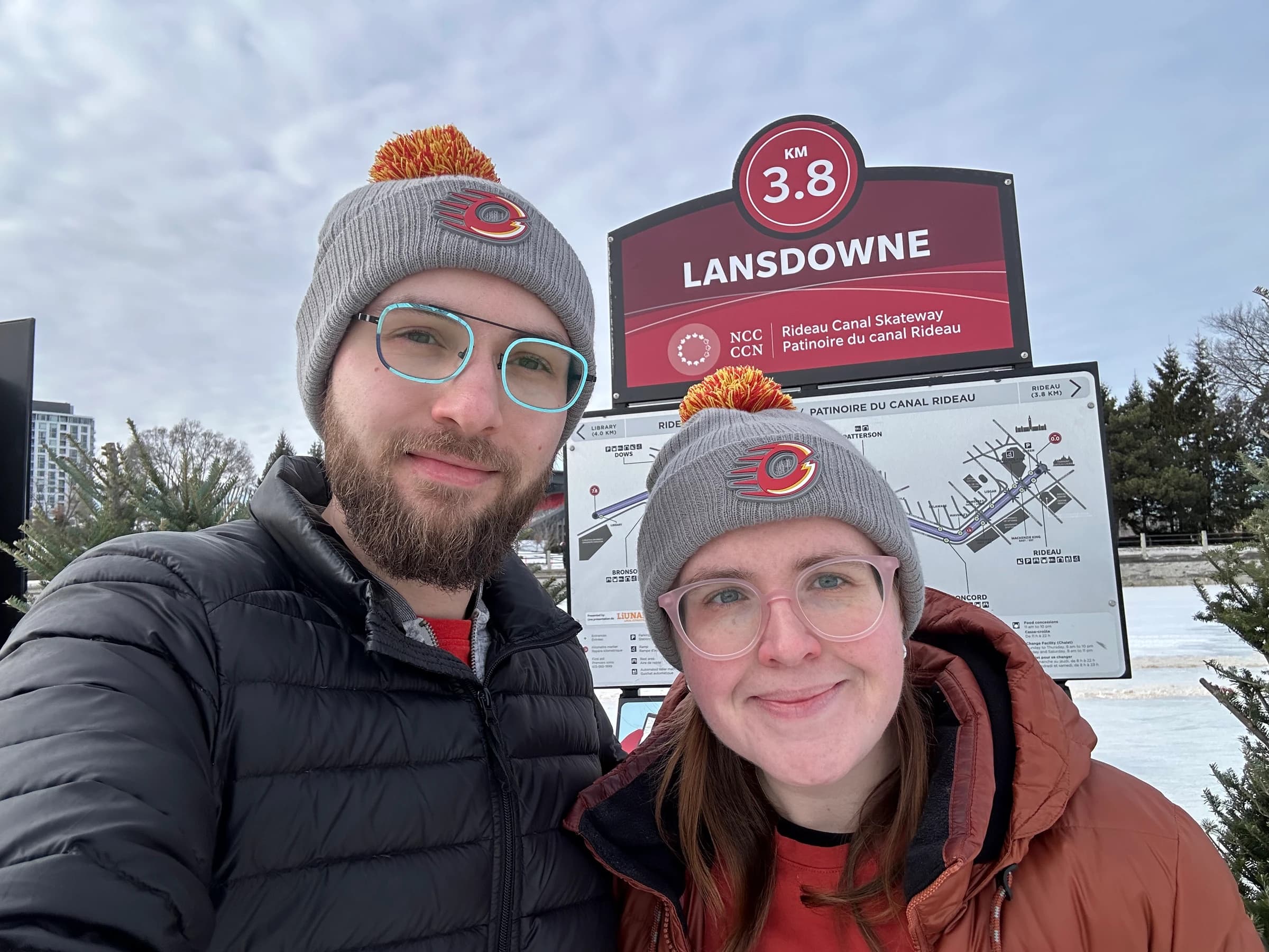 Rachel and Reid in matching toques on the Rideau Canal Skateway at Lansdowne