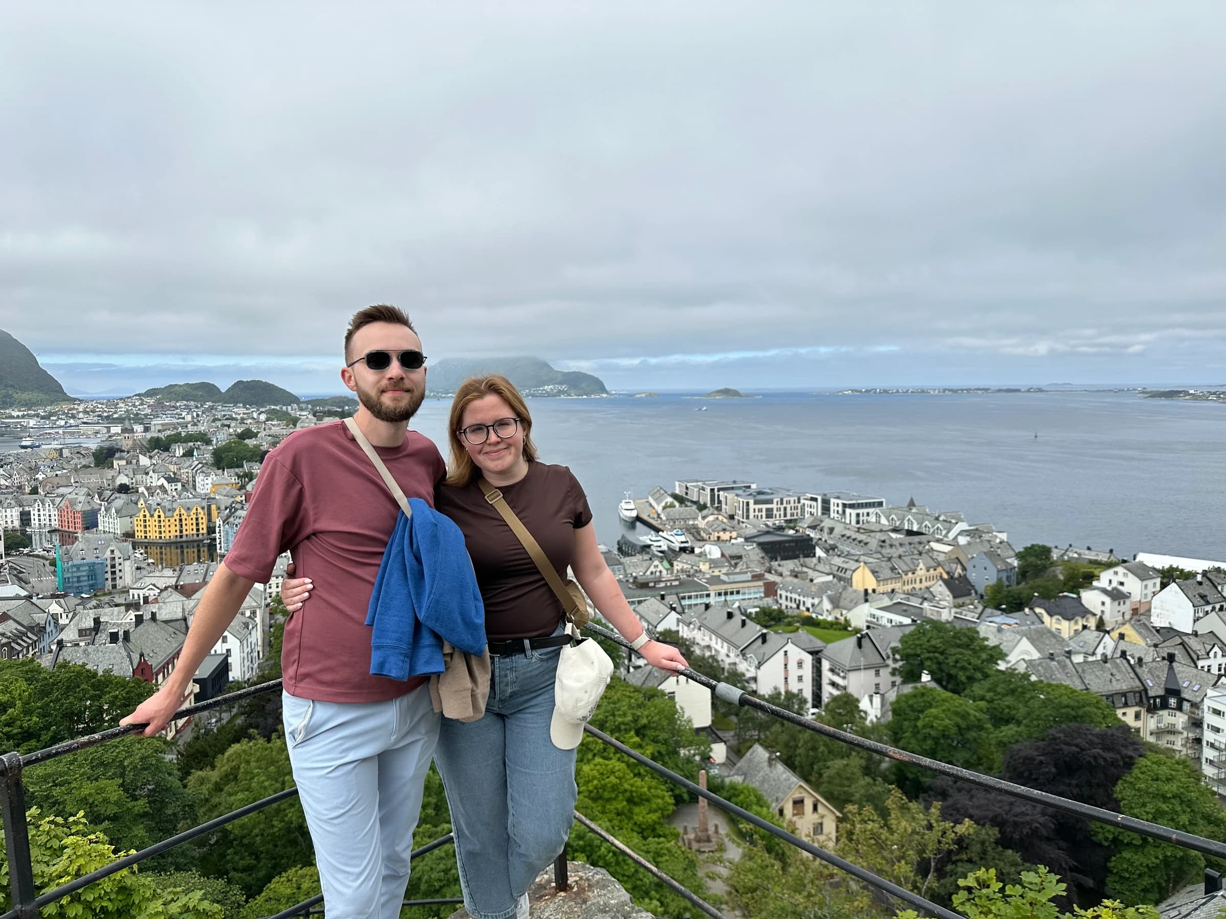 Rachel and Reid at a viewpoint above Ålesund and the fjord
